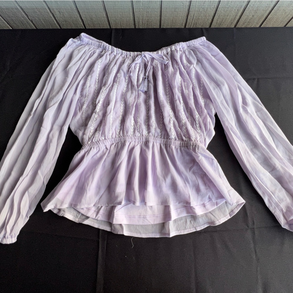 This purple lavender one sleeve top is a MUST & Can be worn with anything